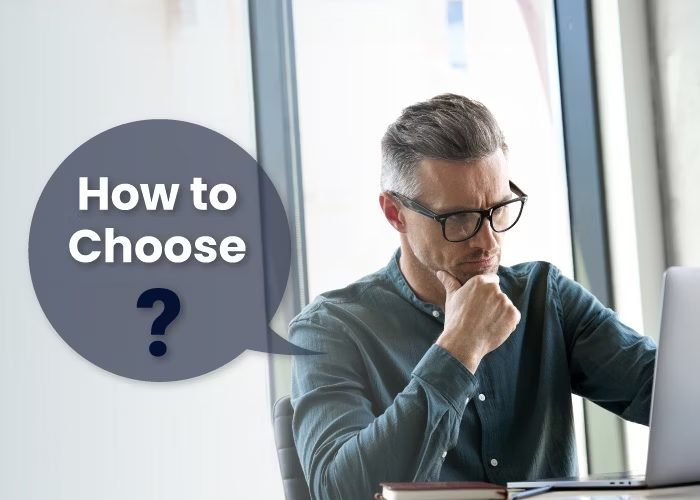 Man thinking at his laptop with a How to Choose speech bubble graphic